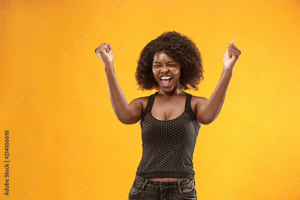 Winning success woman happy ecstatic celebrating being a winner. Dynamic energetic image of female afro model Winning success woman happy ecstatic celebrating being a winner. Dynamic energetic image of female afro model