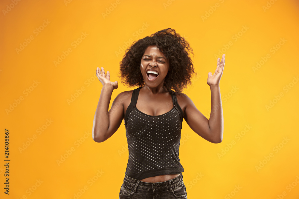 Winning success woman happy ecstatic celebrating being a winner. Dynamic energetic image of female afro model Winning success woman happy ecstatic celebrating being a winner. Dynamic energetic image of female afro model