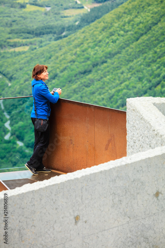 Tourist woman on Trollstigen viewpoint in Norway