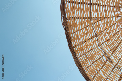 Fototapeta Naklejka Na Ścianę i Meble -  Straw umbrella closeup texture in the daylight