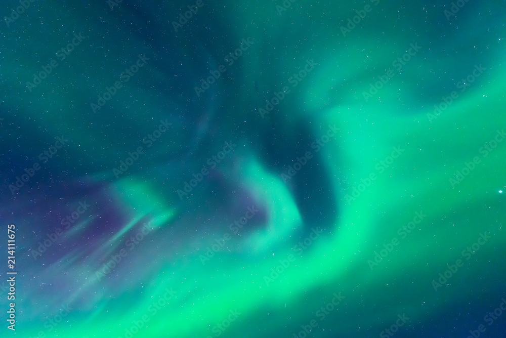 aurora borealis shining bright in the sky of winter iceland 