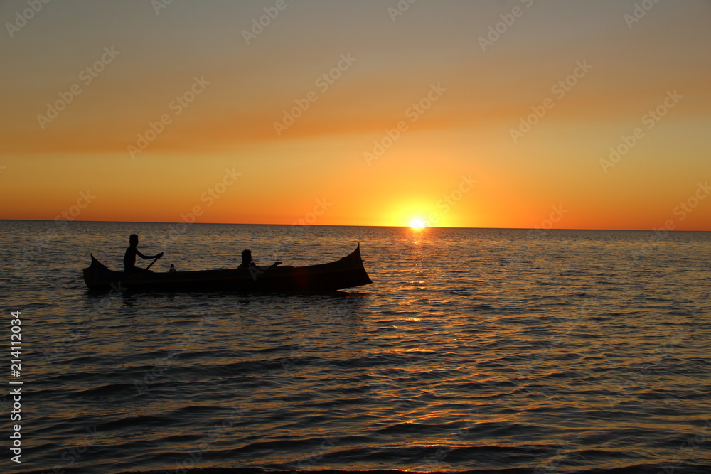 Two boys in the boat on horizon