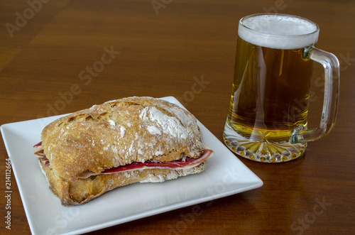 tapa tipica de España, bocciolo de jamón ibérico y jarra de cerveza  photo