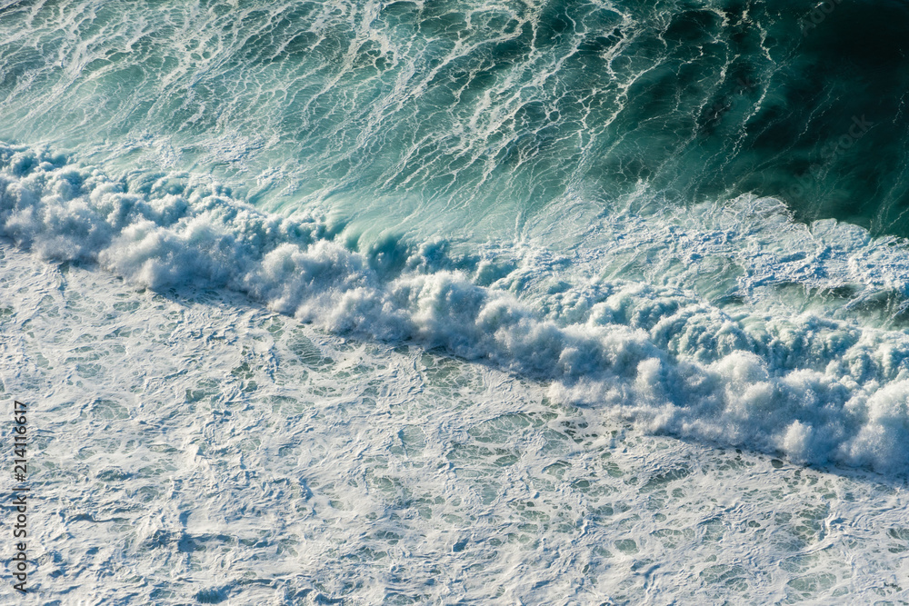 Diagonal rapid splash - aerial view on large coastal waves