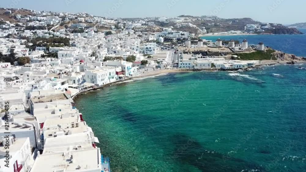 Aerial drone, bird's eye view panoramic video of iconic whitewashed Chora of Mykonos island, Cyclades, Greece