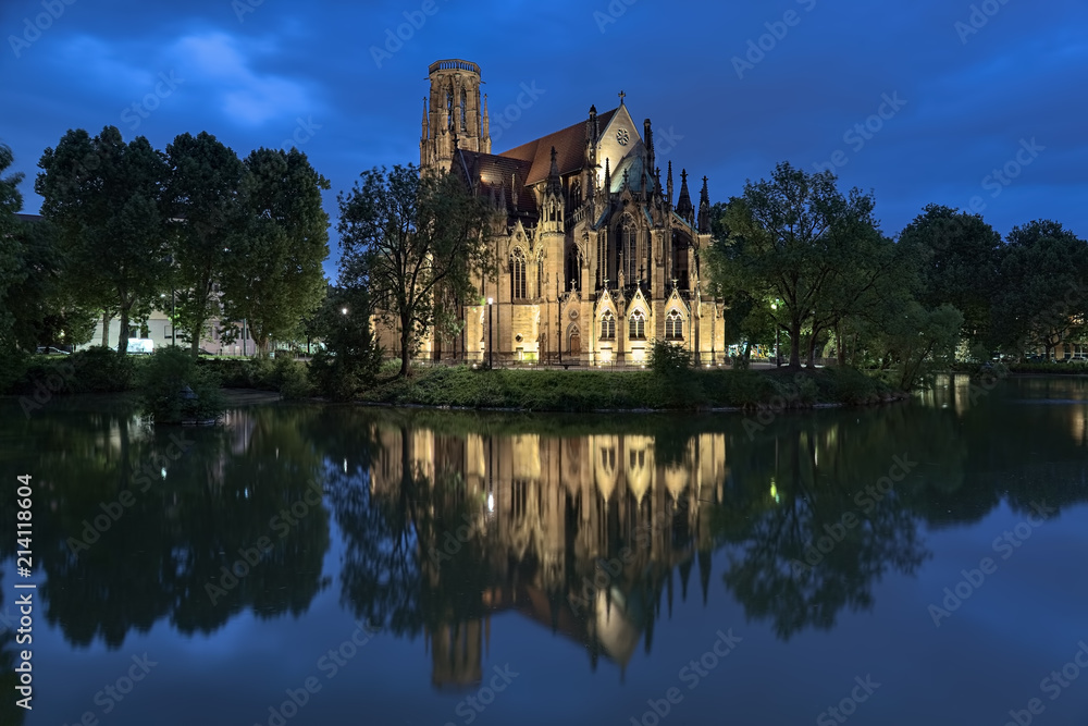 Stuttgart, Germany. Johanneskirche (St John's Church) on the Feuersee (Fire Lake) in dusk. The church was built in 1864-1876.