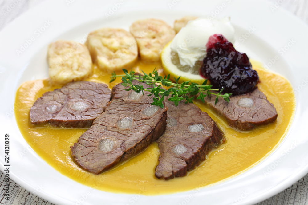 svickova na smetane ( beef in sour cream sauce) served with knedlik (bread dumpling), traditional Czech cuisine