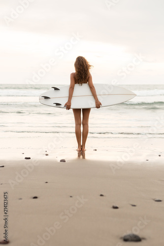 Photography Surf girl with long hair go to surfing
