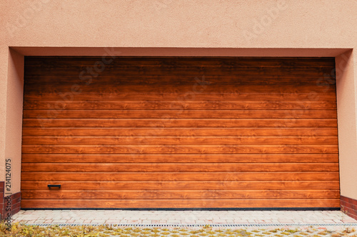 Wooden garage door. Modern garage in new building