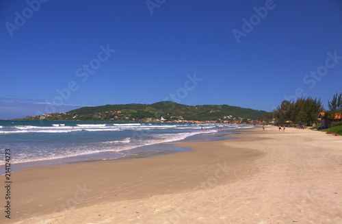 The beautiful beach at the small coastal town of Garopaba on a perfect sunny day.
