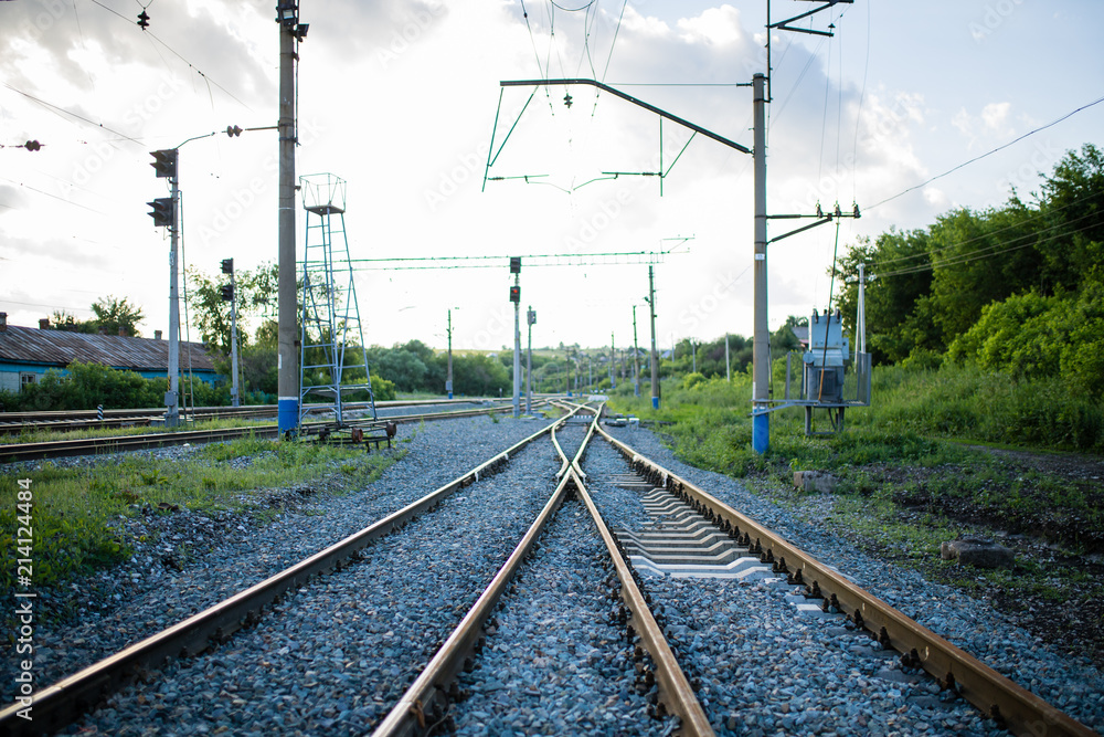 rails stretching into the distance, railroad tracks, turn at the railroad. junction of railway tracks