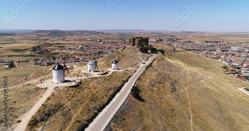 Old windmills and castle in Consuegra Toledo Spain
