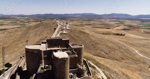 Old windmills and castle in Consuegra Toledo Spain