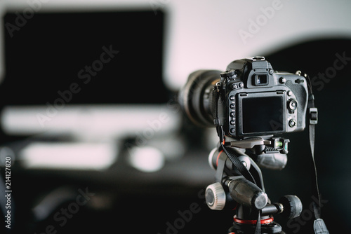 Professional photographer taking indoor pictures of newly renovated office. Camera on tripod details