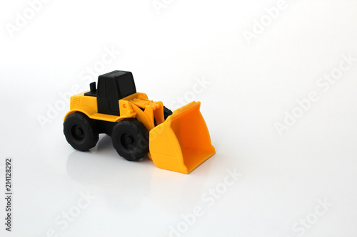 A Toy wheel loader on an isolated white background 2
