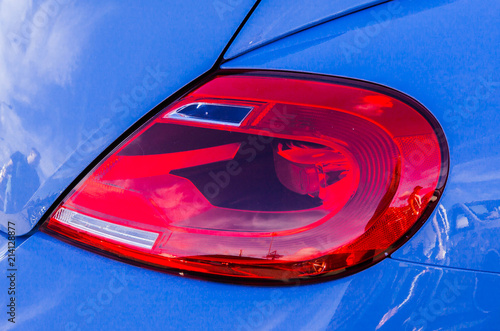 The tail light of the blue car. photo