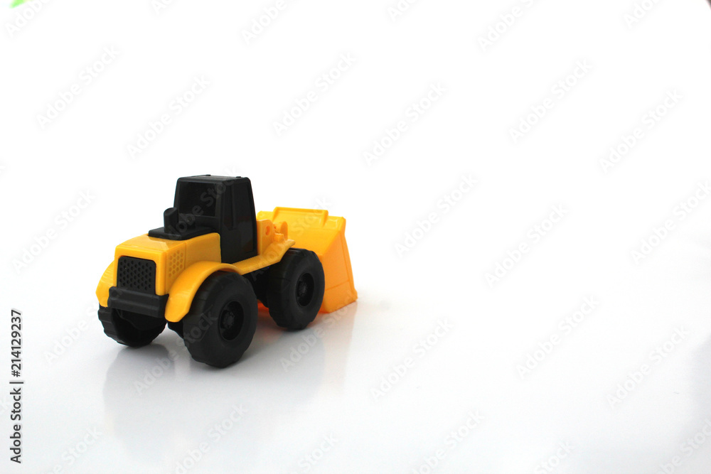 A Toy wheel loader on an isolated white background 10