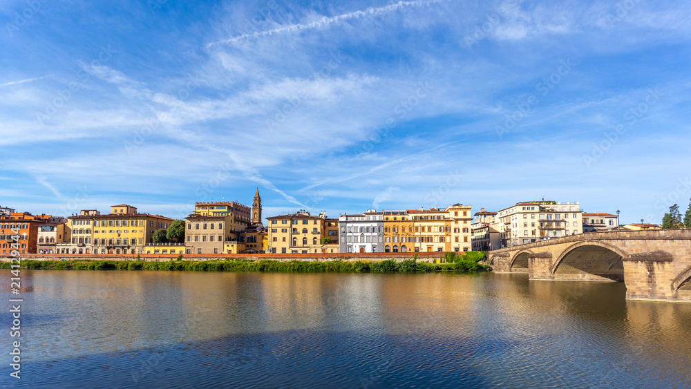 Colorful old buildings line the Arno River in Florence, Italy