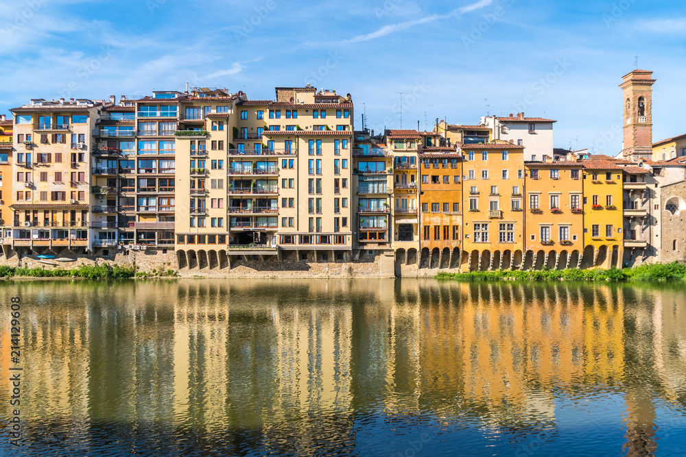 Naklejka premium Colorful old buildings line the Arno River in Florence, Italy