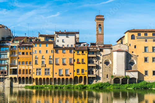 Colorful old buildings line the Arno River in Florence, Italy