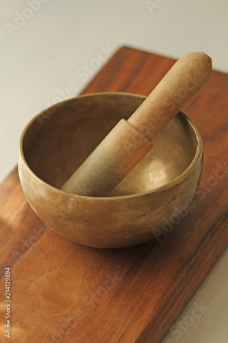 Tibetan singing bowl. Treatment with sound. Alternative medicine, yoga, massage photo