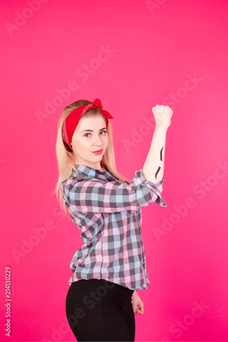 girl in plaid shirt shows eyebrows on different backgrounds and with a happy smile