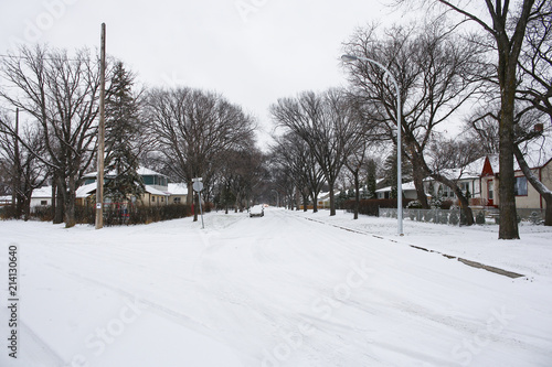 Neighbourhood street after a blizzard. Extreme winter and snow.