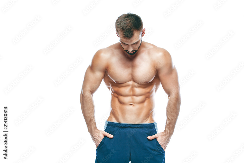 bodybuilder posing. Beautiful sporty guy male power. Fitness muscled in blue shorts. on isolated white background. Man with muscular torso. Strong Athletic Man Fitness Model Torso showing six pack abs