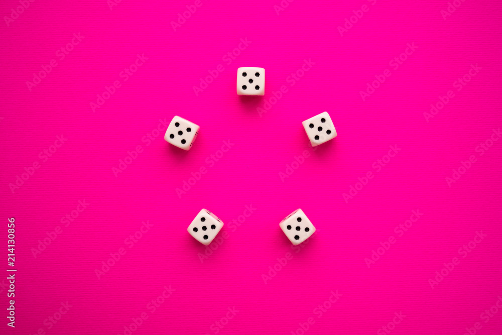 dice on a magenta background dice on a magenta background