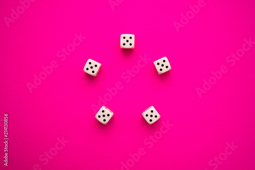 dice on a magenta background