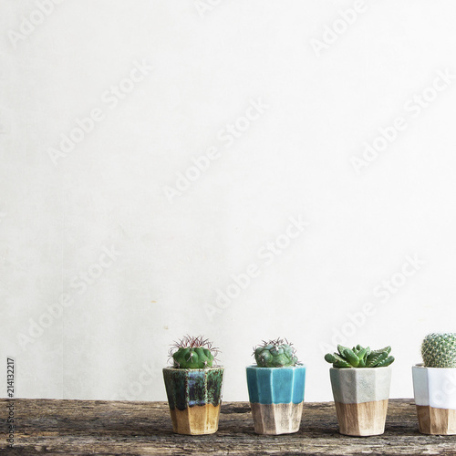 Stylish and modern scandinavian room with wooden console, mock up poster frame and beautiful plants. Design composition of home interior.