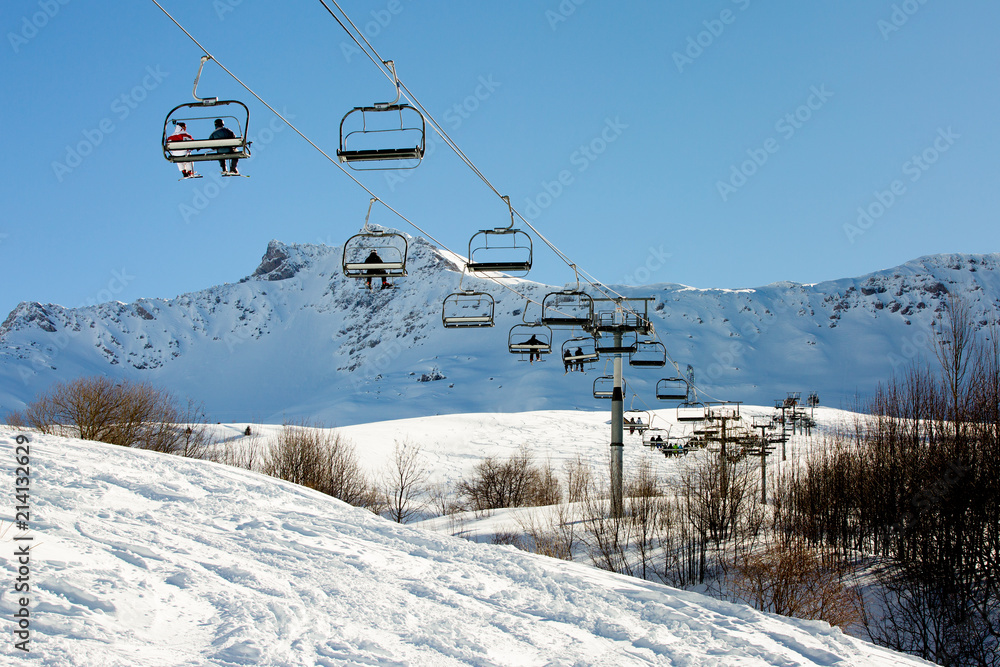 ski lift with tourists in mountains ski lift with tourists in mountains