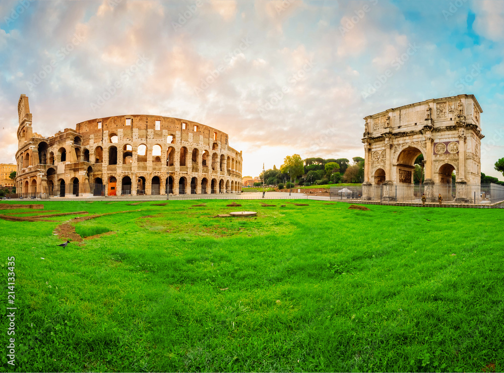 ruins of antique Colosseum and Arch of Constantine in sunise lights, Rome Italy, toned