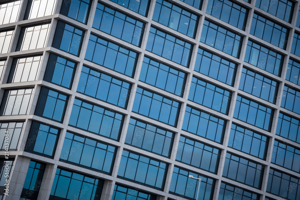 Abstract view of modern blue glass business center on a clear sky background Abstract view of modern blue glass business center on a clear sky background