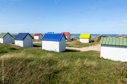 Colorful wooden beach cabins in the dunes  Gouville-sur-Mer  Normandy  France
