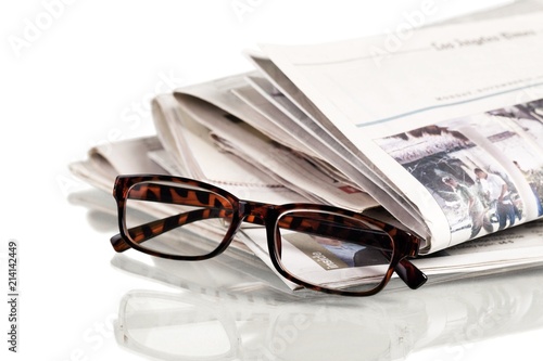 Closeup of Newspapers with Eyeglasses