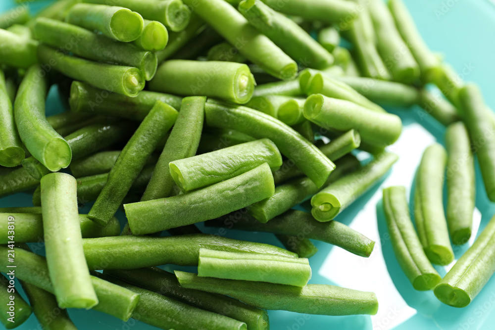 Plate with fresh cut green French beans, closeup Plate with fresh cut green French beans, closeup