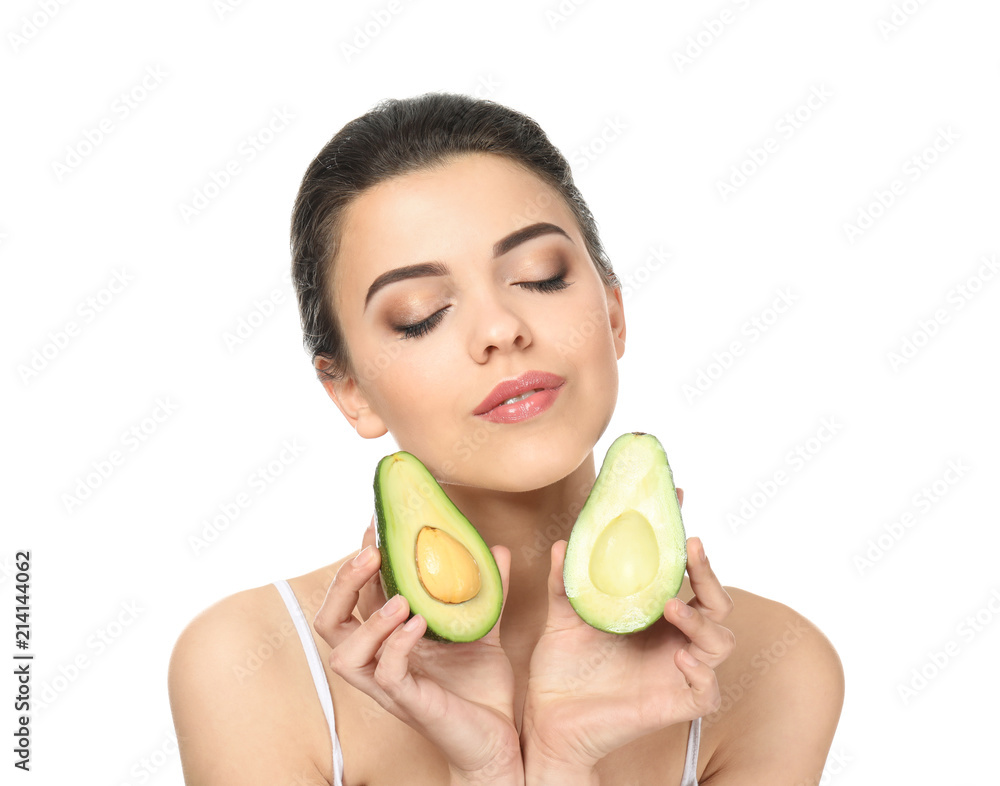 Beautiful young woman with avocado on white background Beautiful young woman with avocado on white background