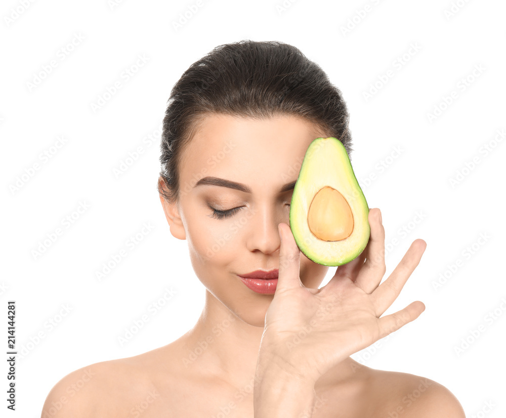 Beautiful young woman with avocado on white background Beautiful young woman with avocado on white background