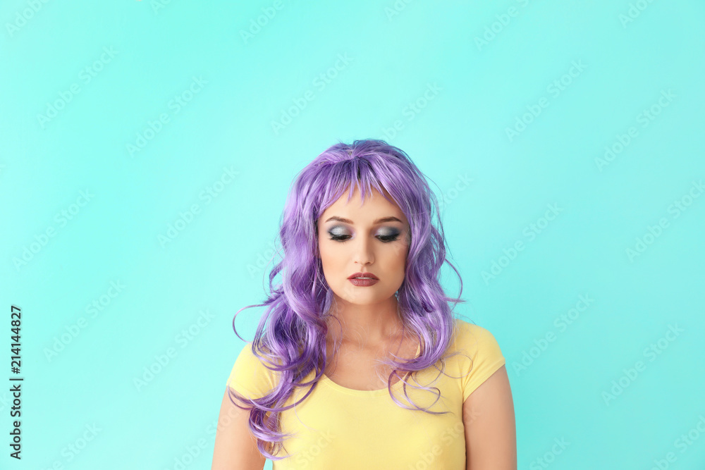 Extravagant young woman on color background Extravagant young woman on color background