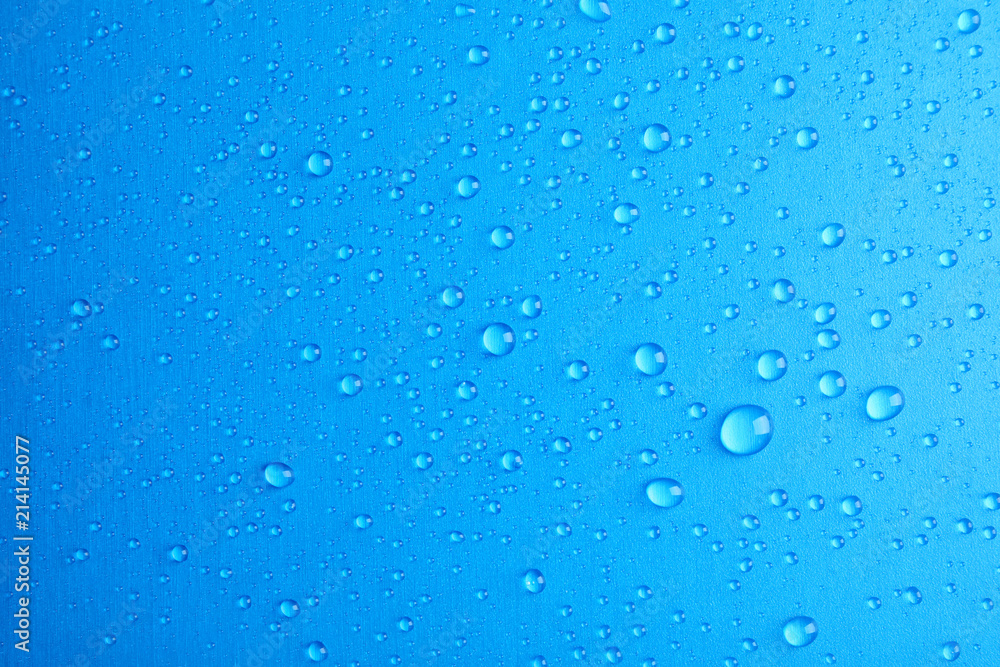 Many clean water drops on color background