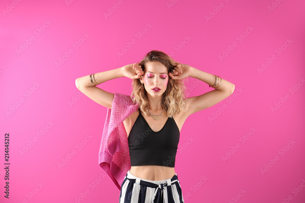 Beautiful young woman posing on color background. Summer fashion Beautiful young woman posing on color background. Summer fashion