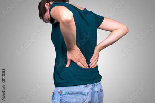 Woman suffering from backache for spondylodiscitis photo