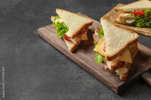 Tasty toast sandwiches on table. Wheat bread