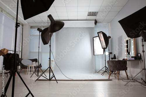 Fototapeta Interior of modern photo studio with professional equipment