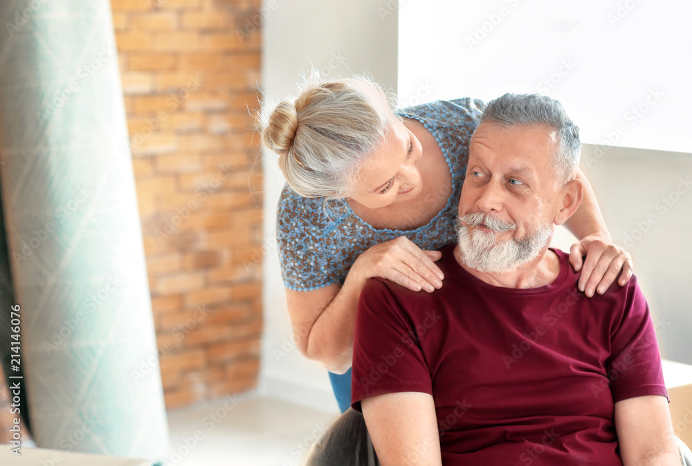 Happy mature couple indoors. Moving into new house Happy mature couple indoors. Moving into new house
