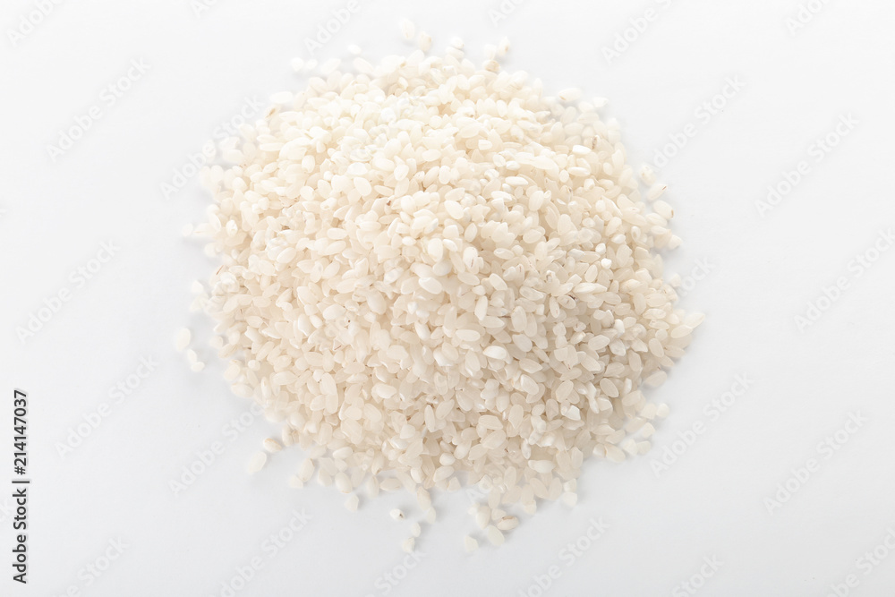 Raw rice on white background. Healthy grains and cereals Raw rice on white background. Healthy grains and cereals