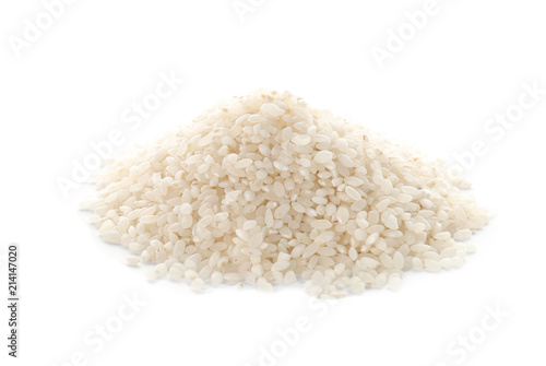Raw rice on white background. Healthy grains and cereals