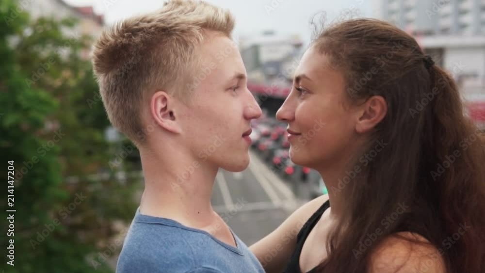 Young beautiful couple in love smiling at urban street Young beautiful couple in love smiling at urban street