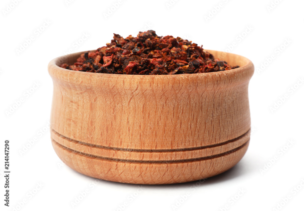 Wooden bowl with dried chili peppers on white background. Different spices Wooden bowl with dried chili peppers on white background. Different spices